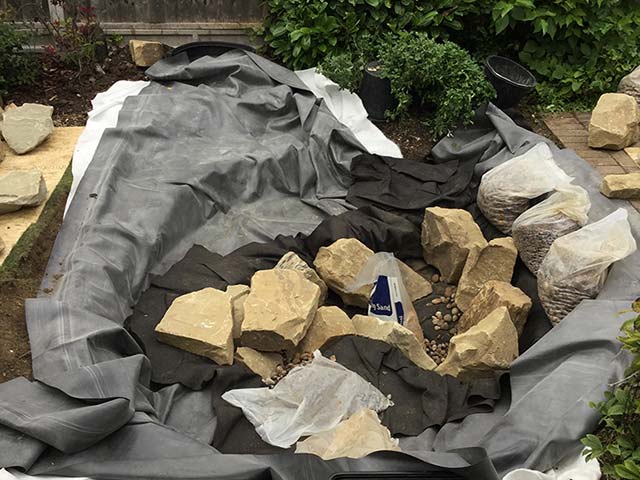 Pond liner in and placing of deep rocks